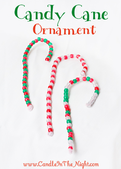 Make these simple candy cane ornaments with your toddler or preschooler to help build fine motor and patterning skills!  Plus, you have a cute ornament to hang on your tree!  | candleinthenight.com