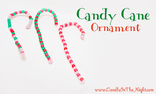 Make these simple candy cane ornaments with your toddler or preschooler to help build fine motor and patterning skills!  Plus, you have a cute ornament to hang on your tree!  | candleinthenight.com