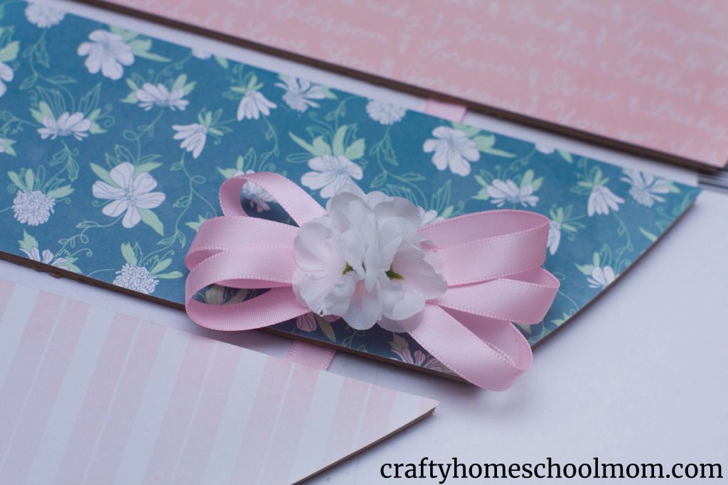 Dollar Tree Heart Makeover - Hot glue flowers to your bow.