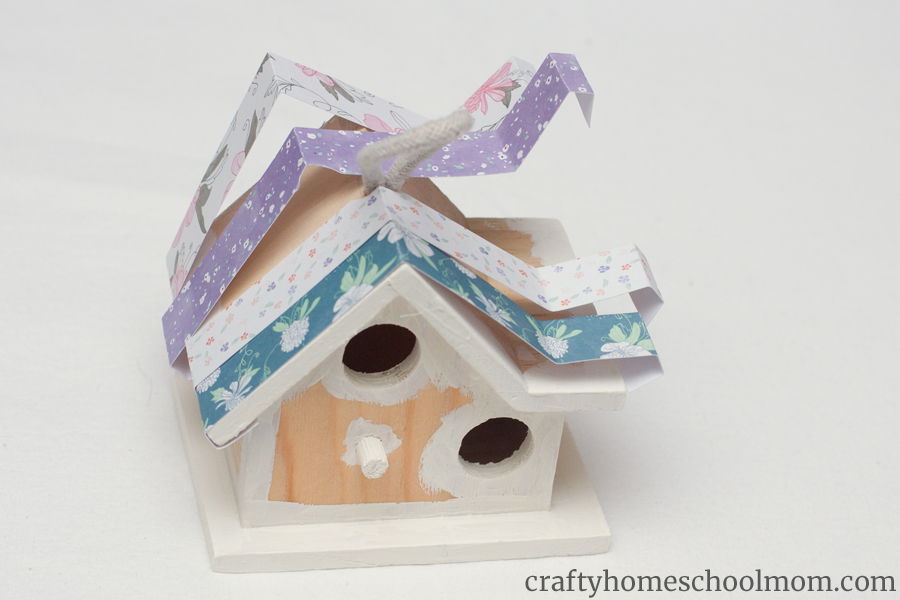 The folds of the paper you're using to decorate your birdhouse should be nice and crisp. 